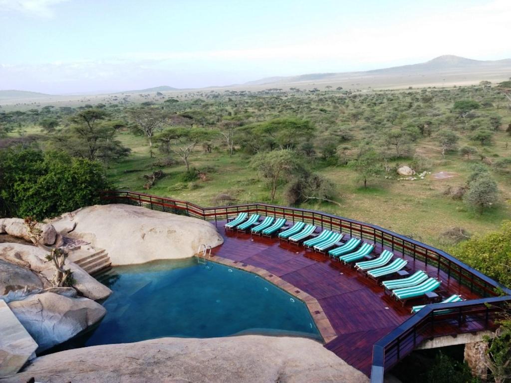 Scenic pool on rock, overlooking vast wilderness
