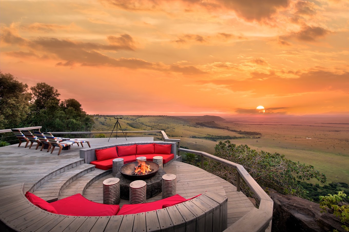 Sunset view from a deck with a fire pit, creating a cozy ambiance in Angama Mara