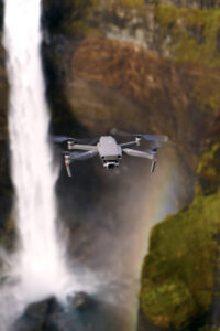Photo of the DJI Mavic 2 Pro quadcopter hovering. Taken in Iceland with Haifoss waterfall and rainbow in background.