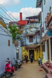 Stone Town, Zanzibar, Tanzania. 27 March 2018. The capital of tanzania, Stone Town. Two Muslim girls in headscarves are walking along a narrow street