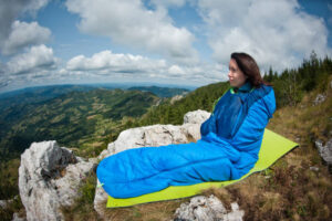 Beautiful girl in the mountains enjoying the view.
