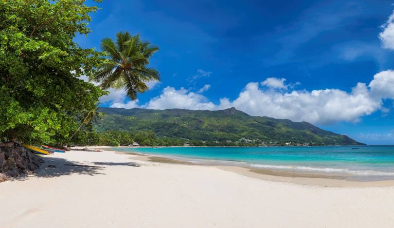 Tranquil Beau Vallon Beach in Seychelles, showcasing golden sands and calm waters, perfect for relaxation and leisure.