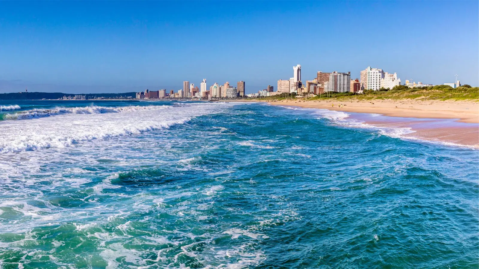 A stunning view of the Gold Coast skyline alongside the beach, showcasing the beauty of South Africa coastal city.