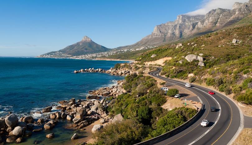 A picturesque stretch of the Garden Route, winding towards Cape Town, highlighting the natural beauty of South Africa.