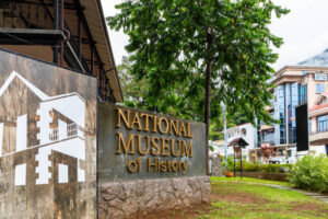 Victoria, Seychelles, 04.05.2021. Entrance to the National Museum of History in Victoria, Seychelles capital, museum sign outside of the building in Victoria city center.