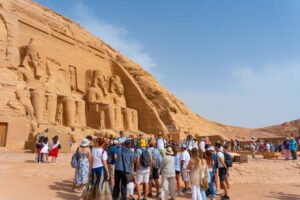 Abu Simbel, Egypt - April 11, 2023: excursion guide informs tourists about the creation and relocation beautiful Temple complex of Abu Simbel